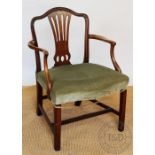 A George III mahogany carver chair, with pierced splat and serpentine fronted upholstered seat,