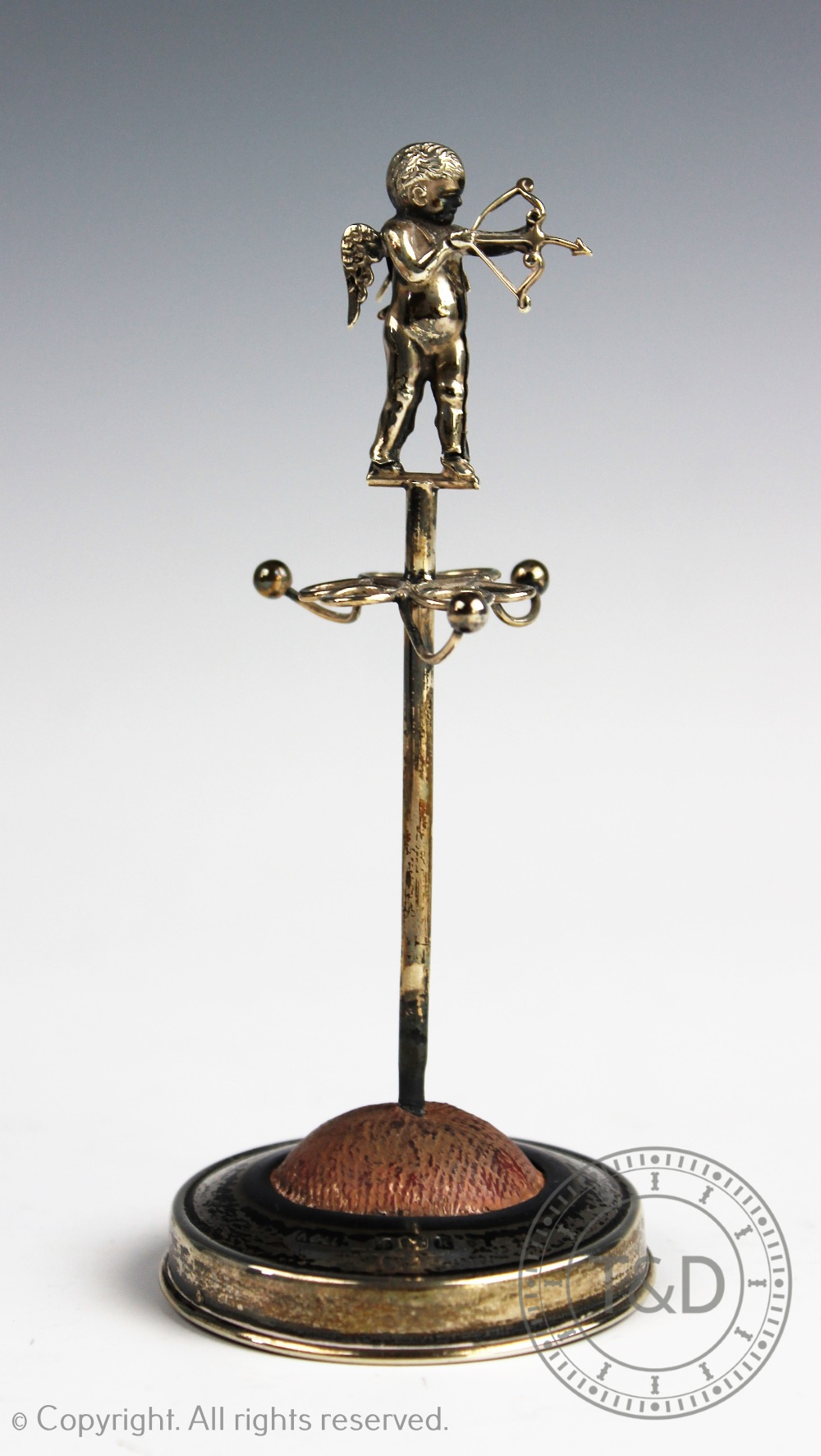 An Edwardian silver hat pin stand with cherub surmount, Birmingham 1909, 11.