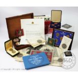 A box of coin collections and commemorative coins to include;