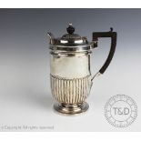 An Edwardian silver hot water pot, Fenton Brothers Ltd, Sheffield 1902,