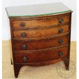 A George III style mahogany bow front chest, of small proportions, with four graduated long drawers,