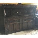 A 17th century and later carved oak court cupboard,