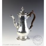 A George III silver coffee pot, London 1765,
