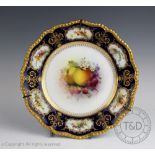 A Royal Worcester fruit painted plate by G H Cole, with apples,