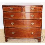 A George III mahogany bow front chest, with two short and three graduated long drawers,