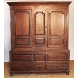 An 18th century and later oak livery cupboard,