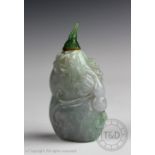 A Chinese carved jadeite snuff bottle and stopper,