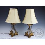 A pair of Victorian gilt metal Egyptian revival lamp bases,