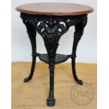 A Britannia pattern cast iron pub table, late 20th century, with circular walnut top,