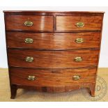 A Regency mahogany bow front chest of two short and three long drawers on bracket feet,