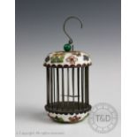 A Chinese enamelled bird cage / insect cage, of cylindrical form and with domed top and base,