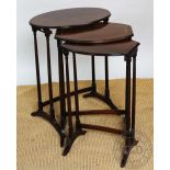 A nest of three early 20th century mahogany occasional tables,