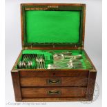 A selection of Old English Pattern silver plated flatware, in an oak canteen,