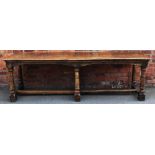 An 18th century style oak refectory type table, with four plank top, on turned legs and block feet,