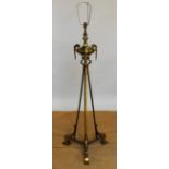 A late Victorian lacquered brass adjustable standard lamp, converted for electricity,