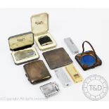 A selection of smoking accessories to include two silver cigarette cases,