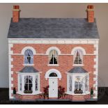 A John Veal Victorian style dolls house,