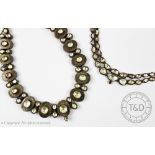 An Indian necklace, designed as a two row, graduated colourless stone set necklace,