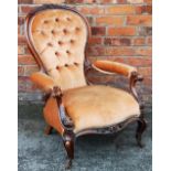 A Victorian carved walnut salon chair,