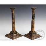 A pair of 19th century Adam style silver plated candlesticks, on swept square bases, 27.