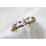 A five stone diamond ring, the five graduated old cut diamonds,