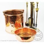 A collection of assorted copper and brass wares to include a copper log bucket with swing handle