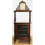 A Victorian inlaid walnut music cabinet, with mirror back above a shelf and glazed cupboard door,