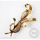 An untested pearl set yellow metal spray brooch,