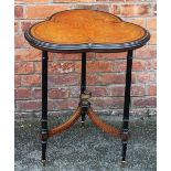 A Victorian ebonised amboyna occasional table, with trefoil shaped top on turned and fluted legs,