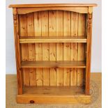 A modern pine open front bookcase, with three adjustable shelves,