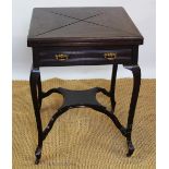 An Edwardian mahogany envelope top card table with drawer upon cabriole legs,