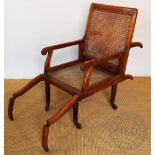 A Victorian mahogany folding campaign chair with caned back and seat