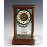 An early 20th century French four glass mantel clock,