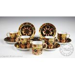 A set of five Royal Crown Derby coffee cans and six saucers,