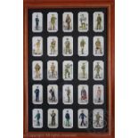 Three framed sets of fifty Players cigarette cards, naval uniform,