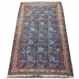 A Caucasian hand woven wool rug, worked with small gulls against a blue ground,