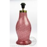 A Murano glass lamp, with spiral red and clear glass pattern, original label to side,