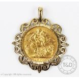 An Edward VII gold Sovereign dated 1910 set within 9ct yellow gold scroll pendant mount,
