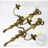 A pair of Regency style twin branch gilt wall sconces,