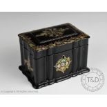 A 19th century lacquered papier mache two division tea caddy,