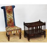 A Victorian prie dieu chair, the tapestry upholstered chair upon turned front legs,