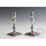 A pair of George II style silver candlesticks, Hawksworth, Eyre & Co Ltd, Sheffield 1892,