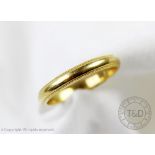 An 18ct yellow gold wedding band, size M, weight 2.