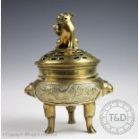 A Chinese bronze tripod koro and cover,