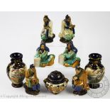 A set of six Chinese pottery sancai glazed scholars, modelled as three pairs all seated,