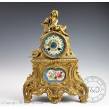 A late 19th century French porcelain inset gilt metal mantel clock,