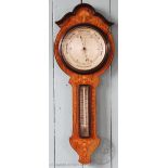 An Edwardian inlaid walnut wheel barometer, 77cm H, and a smaller carved barometer,