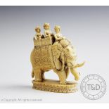 A 19th century carved ivory model of a caparisoned Indian elephant,