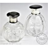 Two silver mounted cut glass scent bottles; Northern Goldsmiths Co, Birmingham 1925,
