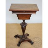 A William IV rosewood work table, with top enclosing a compartmented interior,